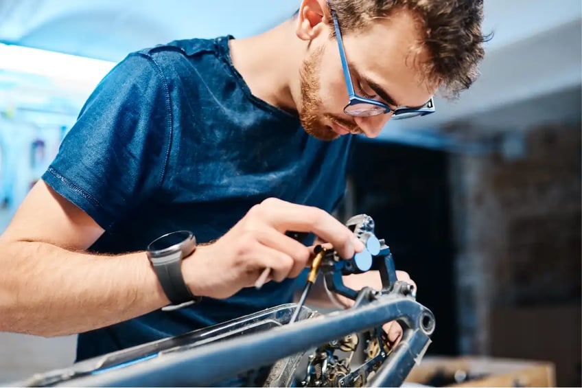 Mechanic Fixing a Bicicle
