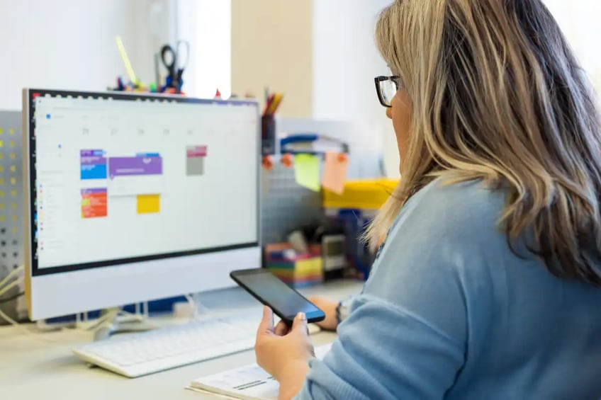 Woman scheduling on a screen