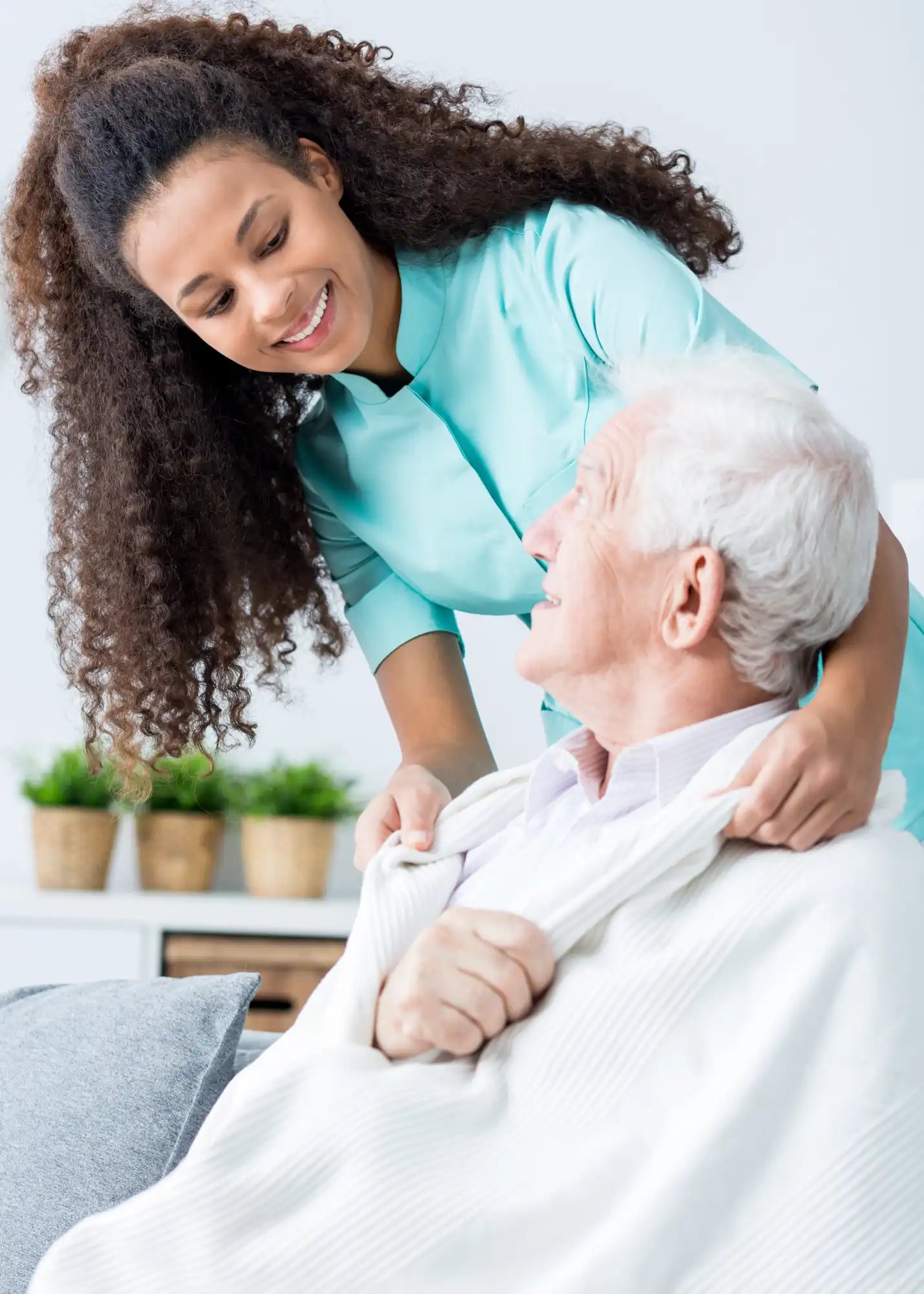 Female caretaker listening to an elderly man