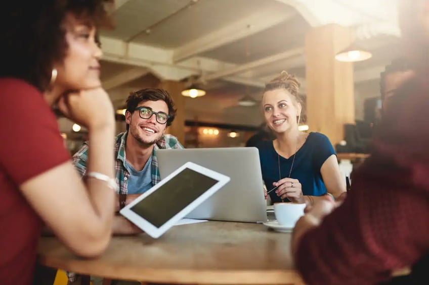 Smiling youngsters in a business meeting
